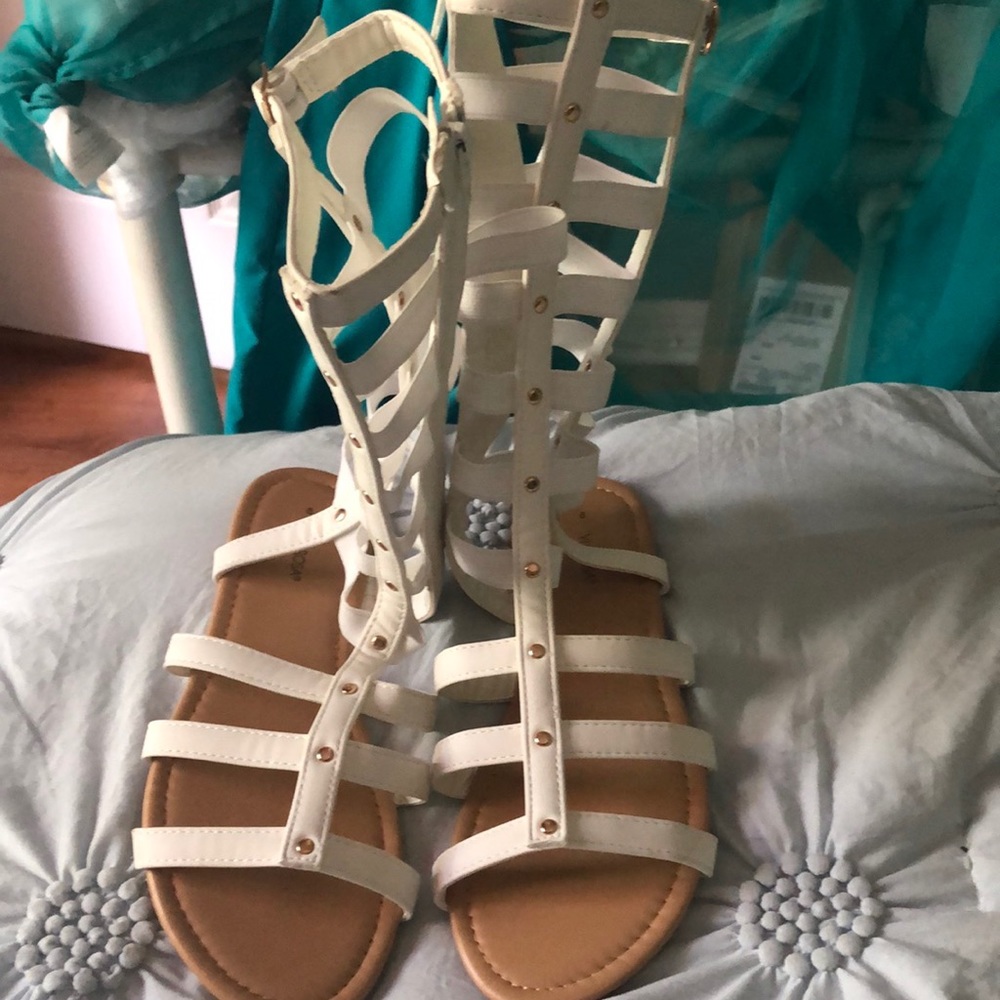These white  sandals are brand new , size 8